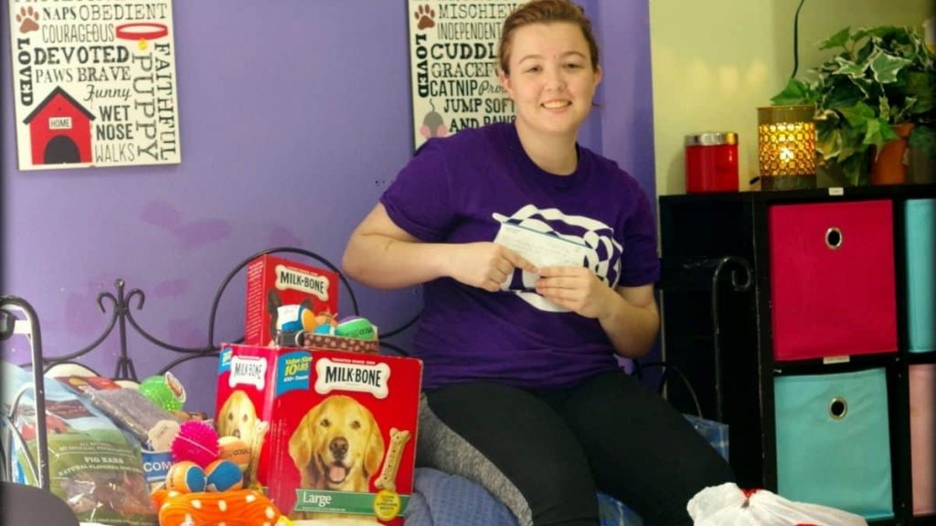 student dropping off donation